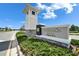 Elegant community sign with stone accents and lush landscaping enhancing the neighborhood's appeal at 28847 Orange Berry Dr, Wesley Chapel, FL 33543