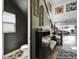 Stylish foyer featuring a decorative accent wall, modern decor, and staircase leading to the upper level at 28847 Orange Berry Dr, Wesley Chapel, FL 33543