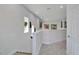 Bright hallway with neutral walls, carpet, and staircase at 28847 Orange Berry Dr, Wesley Chapel, FL 33543