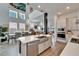 Open-concept kitchen connects to dining and living areas with modern finishes at 28847 Orange Berry Dr, Wesley Chapel, FL 33543