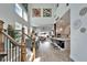 Bright, open-concept living space featuring high ceilings, a modern kitchen, dining area, and comfortable seating at 28847 Orange Berry Dr, Wesley Chapel, FL 33543