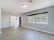 Large bedroom with ample natural light, and gray wood-look tile at 3020 E Louisiana Ave, Tampa, FL 33610