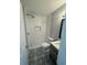 Bathroom featuring patterned floor, tiled shower, and modern vanity at 342 51St N Ave, St Petersburg, FL 33703