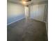 Cozy bedroom featuring gray tile flooring, closet, and ceiling fan at 342 51St N Ave, St Petersburg, FL 33703