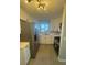 Modern kitchen with stainless steel appliances and white cabinets at 342 51St N Ave, St Petersburg, FL 33703