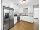Updated kitchen featuring stainless steel appliances, and bright white cabinets with hard surface countertops at 3510 4Th N Ave, St Petersburg, FL 33713
