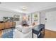 Comfortable living room with large windows, wood flooring, and white sofa at 3510 4Th N Ave, St Petersburg, FL 33713