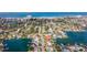 Scenic aerial view of a coastal neighborhood with lush landscaping, waterfront homes, and canals at 368 41St Ave, St Pete Beach, FL 33706
