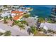 Lovely waterfront home featuring a pool, spacious tiled backyard, and serene water views with private docking at 368 41St Ave, St Pete Beach, FL 33706