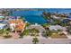 Beautifully maintained waterfront property with mature palms, circular drive and easy access to deep-water docking at 368 41St Ave, St Pete Beach, FL 33706
