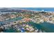Breathtaking aerial perspective of a coastal neighborhood featuring numerous homes with private docks on tranquil waterways at 368 41St Ave, St Pete Beach, FL 33706