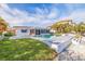 Home showcasing a pool, outdoor seating, screened in porch, and landscaped backyard at 368 41St Ave, St Pete Beach, FL 33706