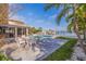 Outdoor patio area by the pool provides a relaxing space for entertainment with waterfront views at 368 41St Ave, St Pete Beach, FL 33706