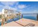 Private boat dock with lift offers waterfront living with stunning views on a sunny day at 368 41St Ave, St Pete Beach, FL 33706