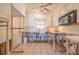 This kitchen features white cabinets and a ceiling fan, awaiting your personal touch at 368 41St Ave, St Pete Beach, FL 33706