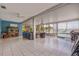 Open concept living area with views of the pool, a ceiling fan, and plenty of natural light at 368 41St Ave, St Pete Beach, FL 33706