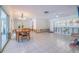 Spacious living area with tile floors, ceiling fans, and natural light, ready for your personal touch at 368 41St Ave, St Pete Beach, FL 33706