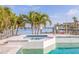 Home offering a pristine pool, waterfront views, and beautiful landscaping at 368 41St Ave, St Pete Beach, FL 33706