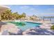 Home offering a backyard with a refreshing pool and dock with picturesque waterfront views at 368 41St Ave, St Pete Beach, FL 33706