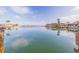 Scenic waterfront view showing the calm water, neighborhood docks, and clear blue sky with clouds at 368 41St Ave, St Pete Beach, FL 33706