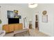 Bright bedroom with modern decor, a wall-mounted television, and access to bathroom at 375 Madeira Cir, St Petersburg, FL 33715