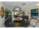 Well-lit dining area with an eclectic mix of decor complements the inviting living space at 375 Madeira Cir, St Petersburg, FL 33715