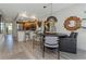 Dining area next to an open kitchen and featuring modern lighting fixtures at 375 Madeira Cir, St Petersburg, FL 33715