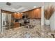 Kitchen features granite countertops, stainless steel appliances, and natural light at 375 Madeira Cir, St Petersburg, FL 33715