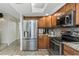 Kitchen features stainless appliances, granite counters and access to other living areas at 375 Madeira Cir, St Petersburg, FL 33715
