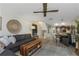 Open-concept living area with comfortable seating and seamless flow to dining and kitchen at 375 Madeira Cir, St Petersburg, FL 33715