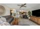 Open-concept living area with comfortable seating and seamless flow to dining and kitchen at 375 Madeira Cir, St Petersburg, FL 33715