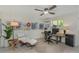 Comfortable home office with desk, lounge chair, ceiling fan and accent lighting at 375 Madeira Cir, St Petersburg, FL 33715