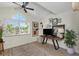 Bright home office with arch window, modern desk, and stylish decor at 375 Madeira Cir, St Petersburg, FL 33715