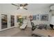 Home office with ceiling fan, lounge chair and workspace with natural light at 375 Madeira Cir, St Petersburg, FL 33715