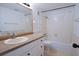 Bathroom featuring a large mirror, vanity, and shower-tub combination at 3803 N Oak Dr # B21, Tampa, FL 33611