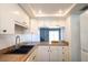 Bright kitchen with white cabinets and wood countertops at 3803 N Oak Dr # B21, Tampa, FL 33611