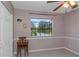 Cozy bedroom with a chair, stylish window, and closet, offering a tranquil retreat at 403 Saint Petersburg W Dr, Oldsmar, FL 34677