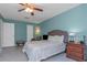 Well-lit bedroom with fresh light blue walls, offering a tranquil and inviting space to relax and unwind at 403 Saint Petersburg W Dr, Oldsmar, FL 34677