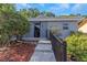 Close-up showcasing the front entrance to the home, with clean lines, and a secure entry at 403 Saint Petersburg W Dr, Oldsmar, FL 34677