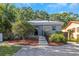 The house is accented with mature trees adding shade and enhanced curb appeal to the property at 403 Saint Petersburg W Dr, Oldsmar, FL 34677