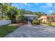 The property boasts a beautifully landscaped yard, showcasing meticulous care and attention to detail at 403 Saint Petersburg W Dr, Oldsmar, FL 34677