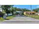 Charming single-story home featuring a long driveway, well-maintained lawn, and welcoming curb appeal at 403 Saint Petersburg W Dr, Oldsmar, FL 34677