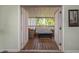 Charming French doors leading to a screened porch; ideal for enjoying outdoor living from the comfort of indoors at 403 Saint Petersburg W Dr, Oldsmar, FL 34677