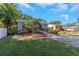 Lush landscaping and inviting walkway enhancing the curb appeal of this well-maintained home at 403 Saint Petersburg W Dr, Oldsmar, FL 34677