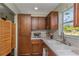 Well-organized kitchen features updated cabinetry and countertops, providing a clean and efficient cooking environment at 403 Saint Petersburg W Dr, Oldsmar, FL 34677