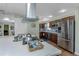 Bright modern kitchen with stainless appliances and island at 403 Saint Petersburg W Dr, Oldsmar, FL 34677