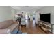 Open-concept living room with hardwood floors and plenty of natural light at 403 Saint Petersburg W Dr, Oldsmar, FL 34677