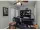 A dedicated office space featuring neutral walls, natural light, and built-in bookshelves at 403 Saint Petersburg W Dr, Oldsmar, FL 34677