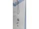 Modern shower featuring a handheld shower head, tiled wall, and updated fixtures at 403 Saint Petersburg W Dr, Oldsmar, FL 34677
