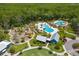 Breathtaking aerial view of a recreational community featuring a playground, pool, green space, and clubhouse at 4224 Crayford Ct, Land O Lakes, FL 34638